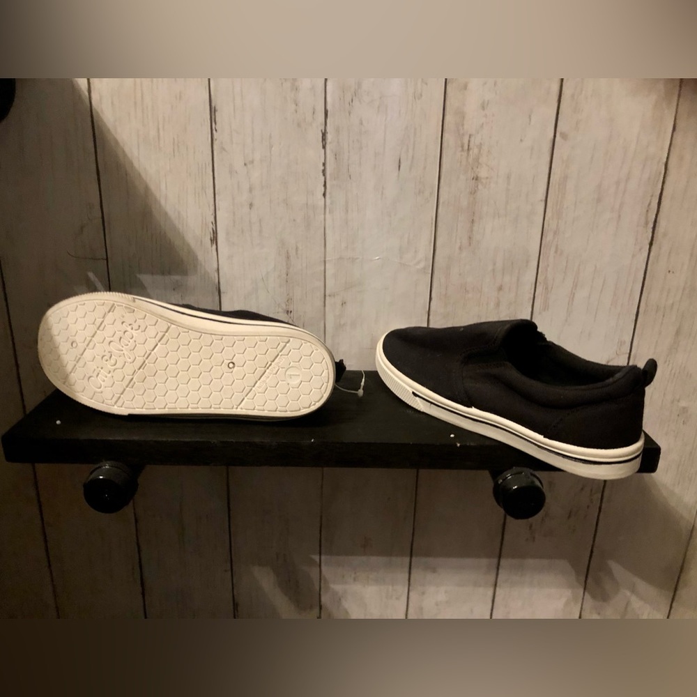 Black slide on tennis shoes. Cat and Jack child’s size 1. Never worn.